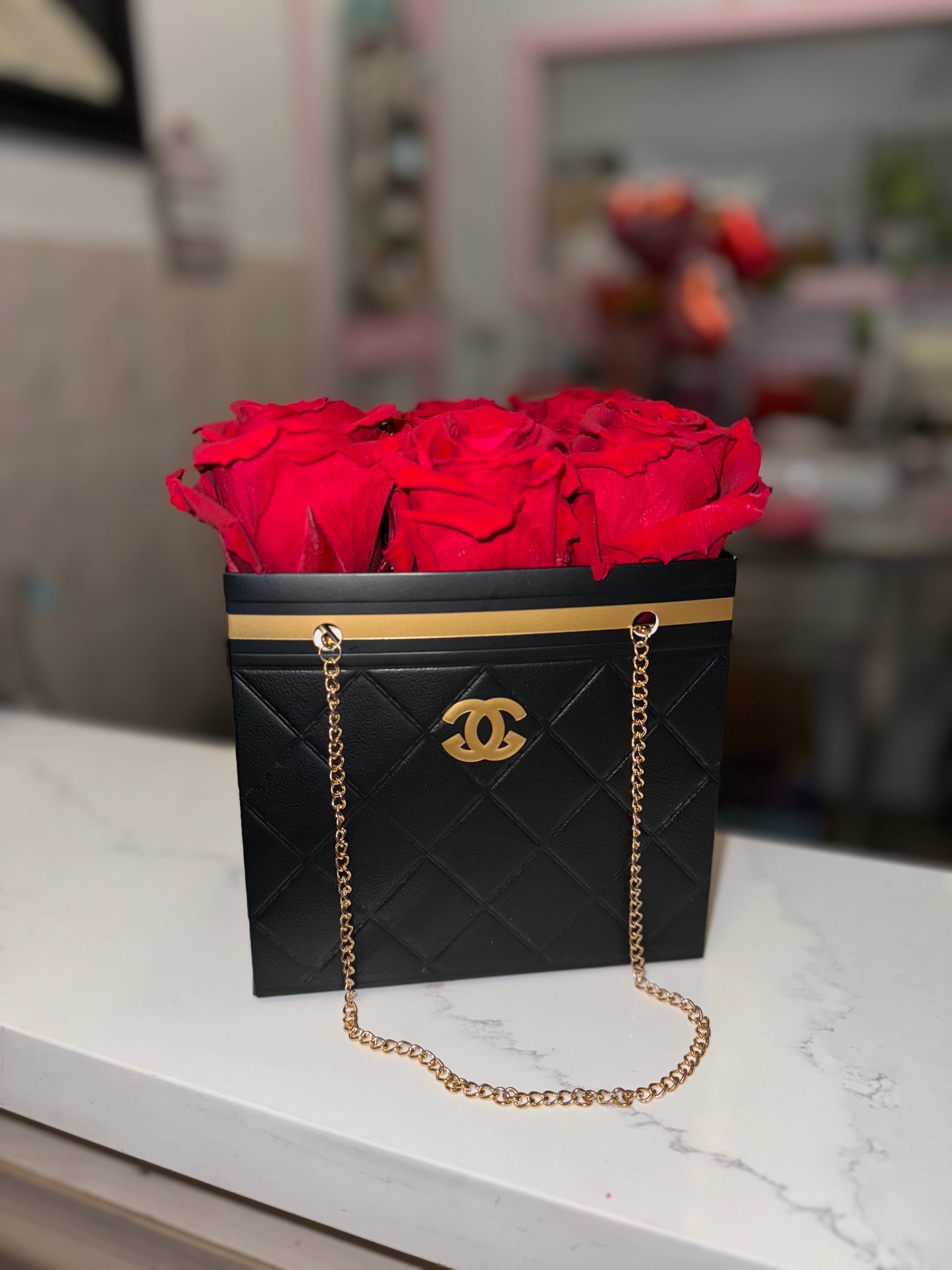 Red Preserved Roses in a Chanel Gift Bag